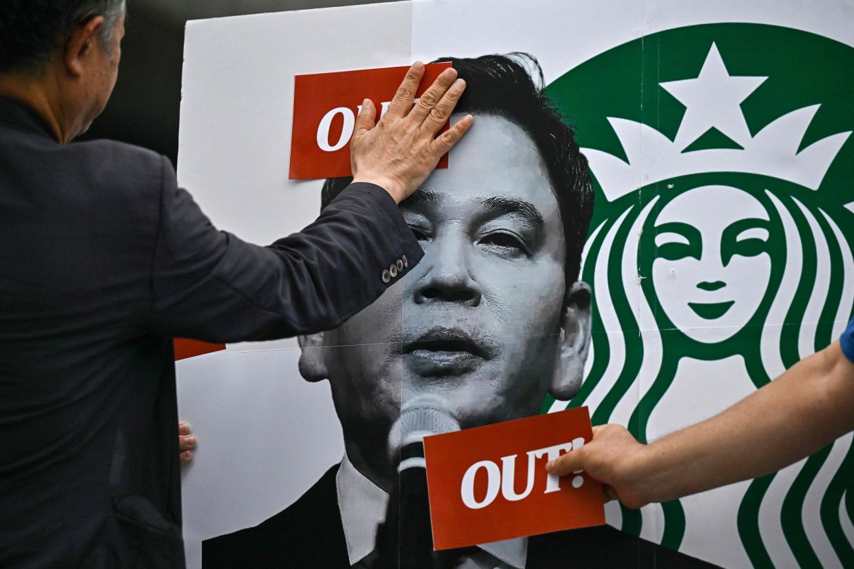 South Korean police interrogate Starbucks executive over insensitive 'Tank Day' promotion
