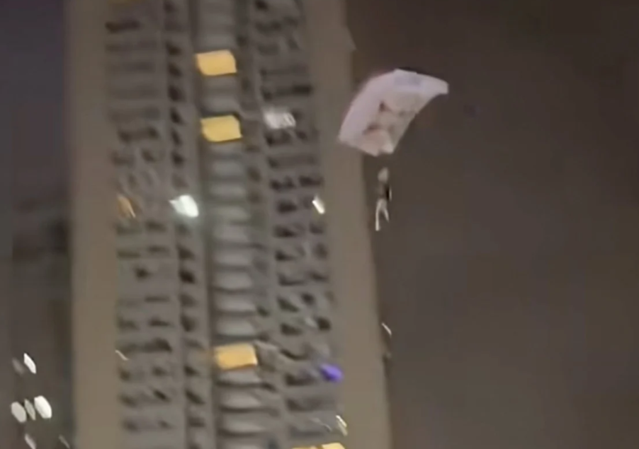Chinese man detained after illegal skydiving stunt from residential building