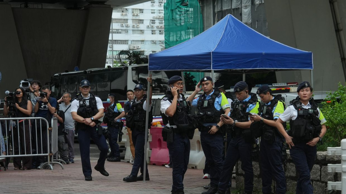 Hong Kong arrests woman over seditious T-shirt as democracy advocates face conviction