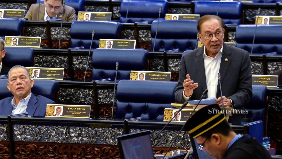 E-wallet firms must compensate scam victims if security measures fail, Anwar declares