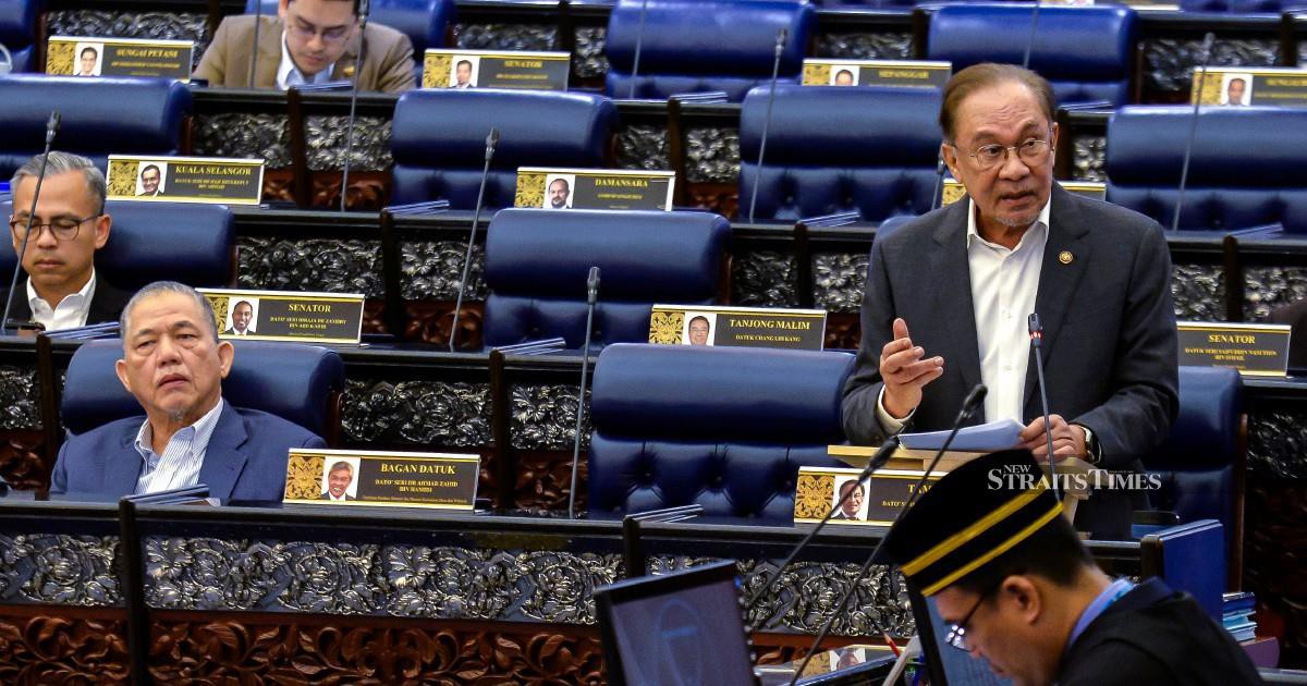 E-wallet firms must compensate scam victims if security measures fail, Anwar declares